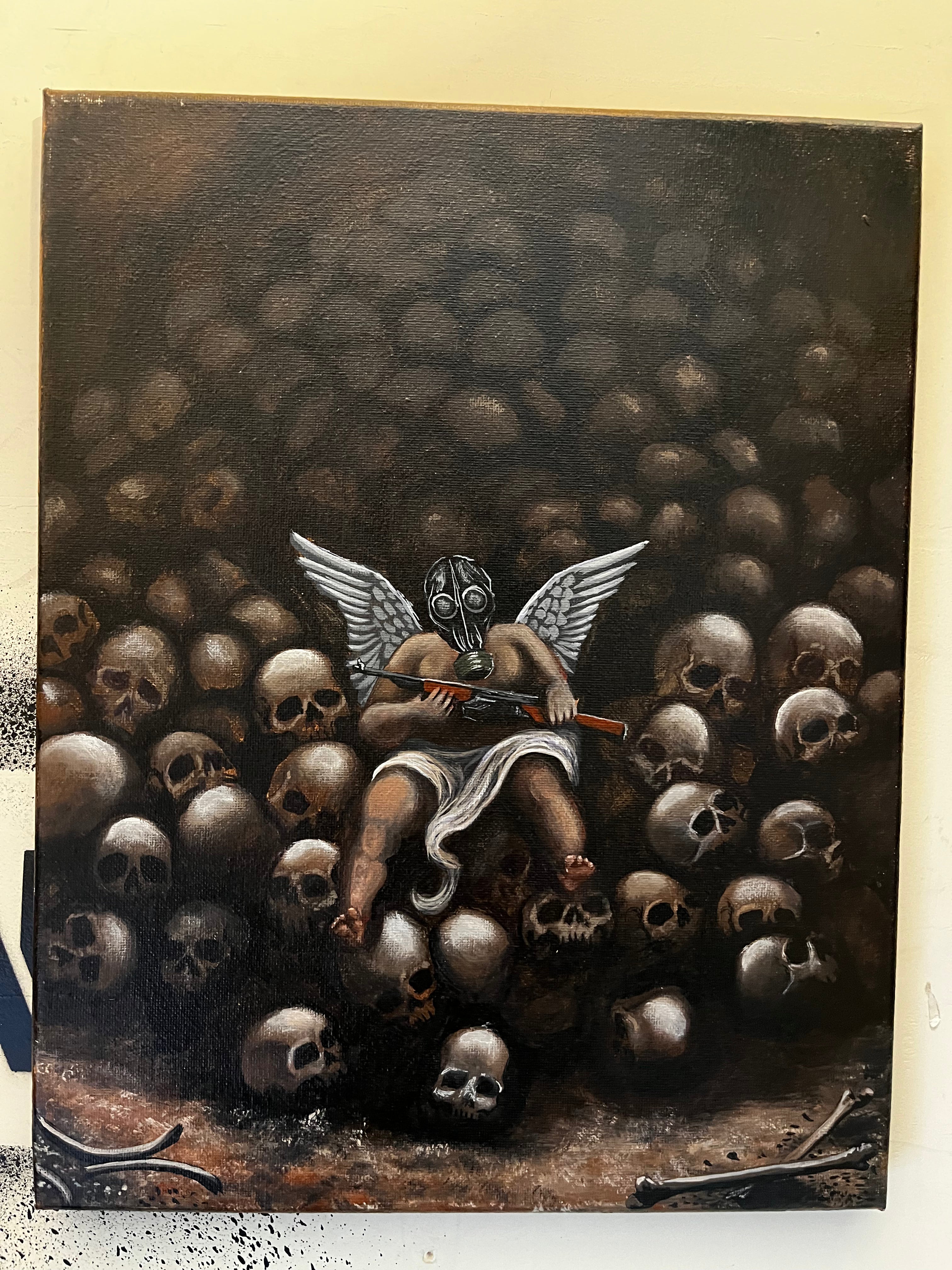 Love holds rifle on pile of skulls