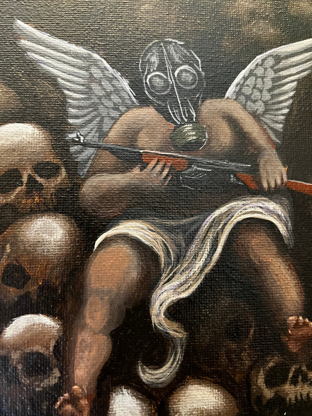 Love holds rifle on pile of skulls
